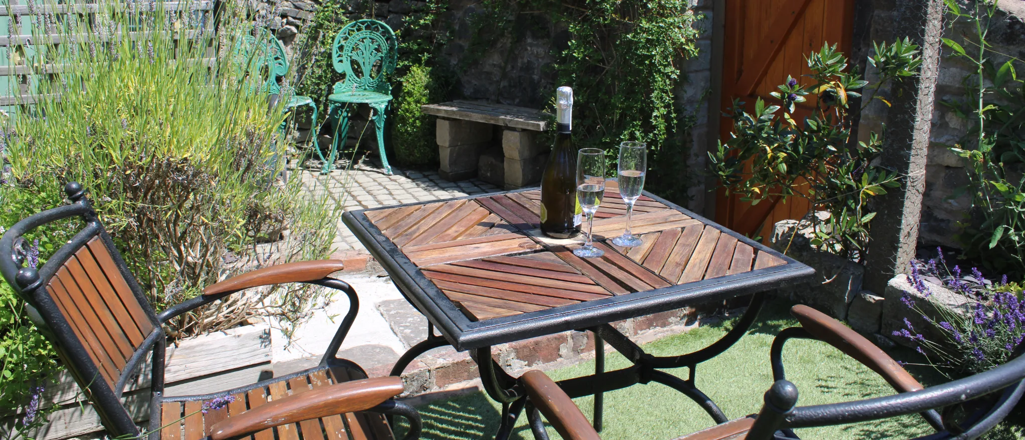 Patio table and seating in the private garden at Kibble Cottage