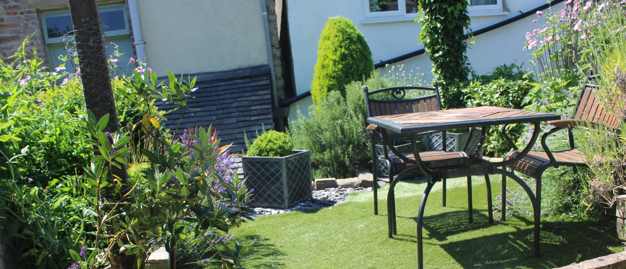 Private garden and outdoor seating at Kibble Cottage