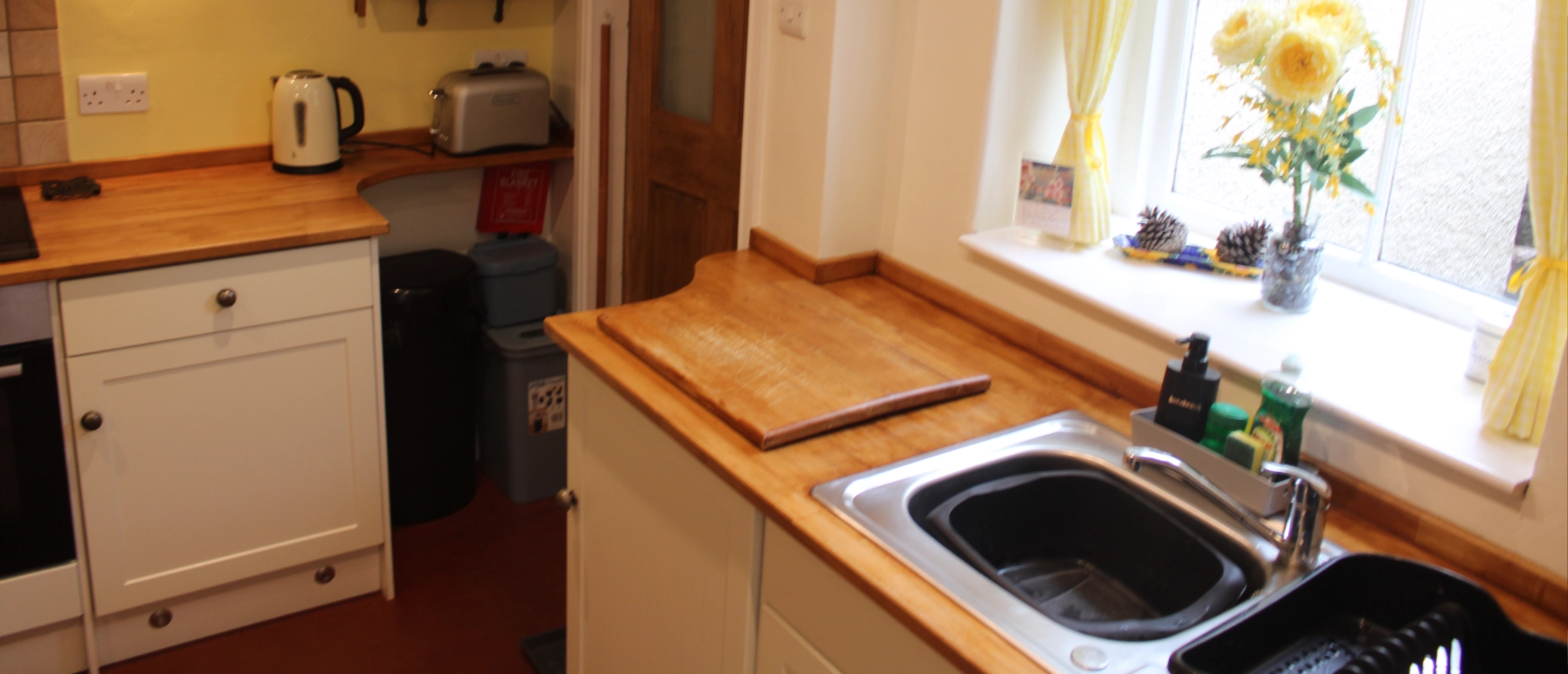 Kitchen sink and wooden worktop at Kibble Cottage